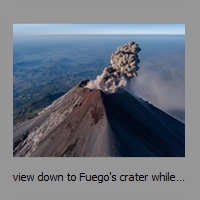 view down to Fuego's crater while new eruption starts